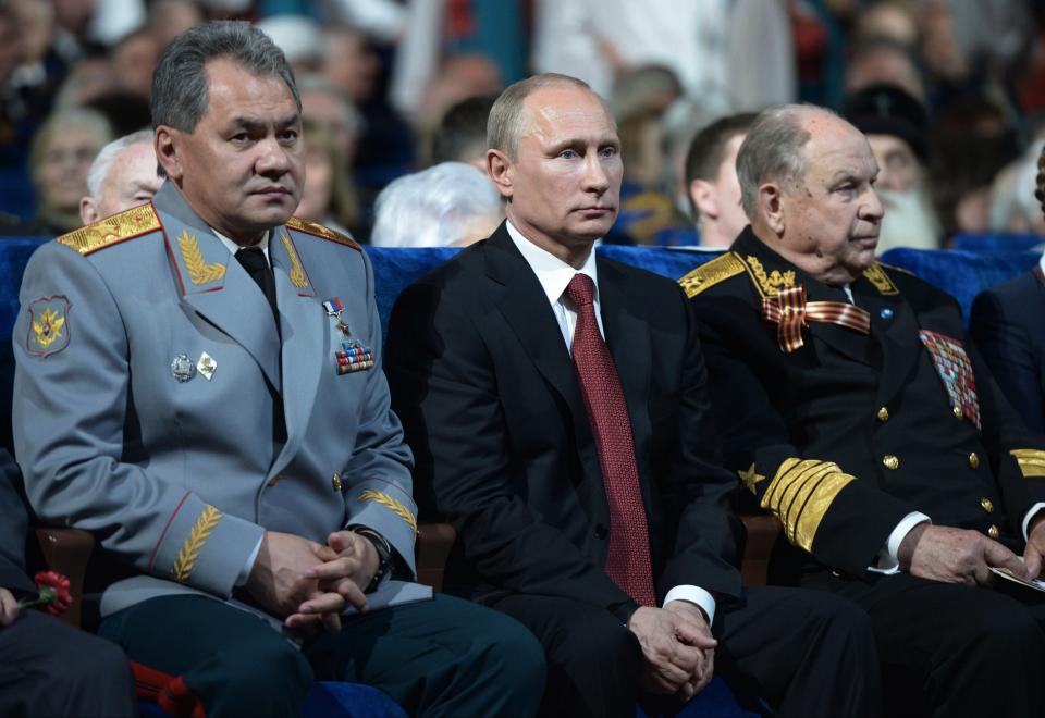 Russian President Vladimir Putin, center, and Defense Minister Sergei Shoigu, left, attend a gala concert on the eve of Victory Day marking the defeat of Nazi Germany 69 years ago, in the Kremlin in Moscow, Russia, Thursday, May 8, 2014. Russia will mark Victory Day on May 9 holding a military parade in Red Square in Moscow. (AP Photo/RIA-Novosti, Alexei Nikolsky, Presidential Press Service)