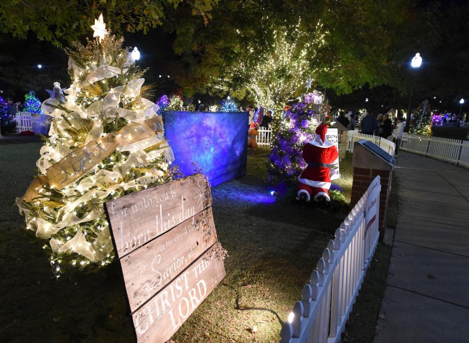 Nov 21, 2022; Tuscaloosa, Alabama, USA;  The Tinsel Trail opened in Government Plaza Monday night. Crowds of viewers walked the paths to view the decorated trees.