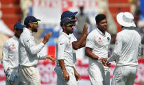 Cricket - India v England - Second Test cricket match - Dr. Y.S. Rajasekhara Reddy ACA-VDCA Cricket Stadium, Visakhapatnam, India - 19/11/16. India's Umesh Yadav (2nd R) celebrates with team mates the dismissal England's Jonny Bairstow. REUTERS/Danish Siddiqui