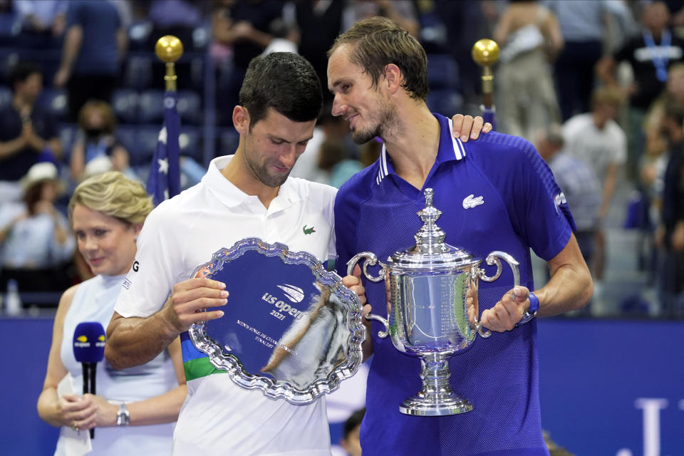 Daniil Medvedev, of Russia, right, talks with Novak Djokovic, of Serbia, after defeating Djokovic in the men's singles final of the US Open tennis championships, Sunday, Sept. 12, 2021, in New York. (AP Photo/John Minchillo)