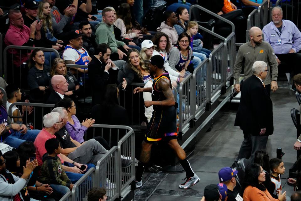 December 15, 2023; Phoenix, Ariz.; USA; Suns guard Bradley Beal (3) walks off the court after falling on a made three pointer being fouled by Knicks guard Donte DiVincenzo during a game at the Footprint Center.