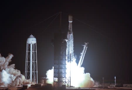 A SpaceX Falcon Heavy rocket, carrying the U.S. Air Force's Space Test Program 2 Mission, lifts off from the Kennedy Space Center in Cape Canaveral, Florida