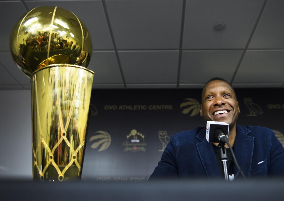 Toronto Raptors NBA basketball team president Masai Ujiri speaks to the media during an end-of-season press conference in Toronto, Tuesday, June 25, 2019. At left is the Larry O'Brien Trophy. (Nathan Denette/The Canadian Press via AP)
