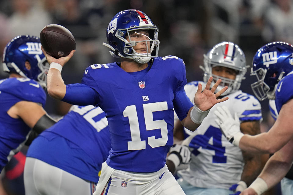New York Giants quarterback Tommy DeVito (15) throws in the first half of an NFL football game against the Dallas Cowboys, Sunday, Nov. 12, 2023, in Arlington, Texas. (AP Photo/Julio Cortez)