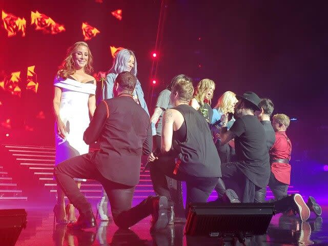 The singers sweetly escorted their gorgeous wives on stage during their final 'Larger Than Life' residency gig in Las Vegas.