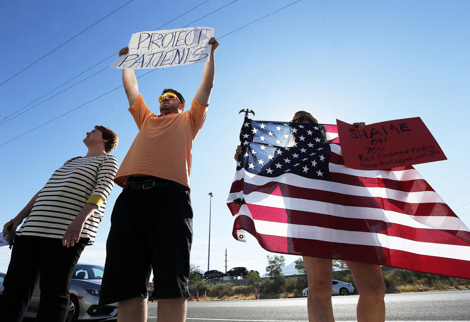 <p>Kellie Henderson, left, Ryan Jensen and Sue Corth stand outside as U.S. Health and Human Services Secretary Tom Price meets with business leaders at Colonial Flag in Sandy, Utah, on Monday, June 26, 2017. (Photo: avell Call/The Deseret News via AP) </p>