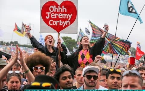 Young people cheer on Jeremy Corbyn as he addresses revellers at Glastonbury Festival - Credit: Matt Cardy/Getty Images