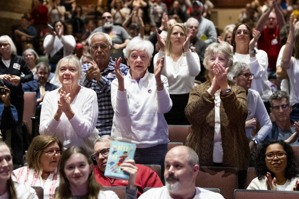 Supporters of reinstating the Maulik Pancholy assembly cheer during the Cumberland Valley School Board special meeting to discuss their decision to cancel the assembly, Wednesday, April 24, 2024 in Mechanicsburg, Pa. The Cumberland Valley School District’s board voted 5-4 Wednesday to allow Pancholy, who is gay, to speak against bullying during a May 22 assembly at Mountain View Middle School. (Joe Hermitt/The Patriot-News via AP)