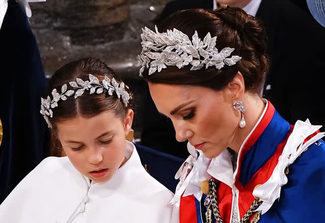 <p>Yui Mok//Getty</p> Princess Charlotte and Kate Middleton at the coronation of King Charles and Queen Camilla in May 2023.