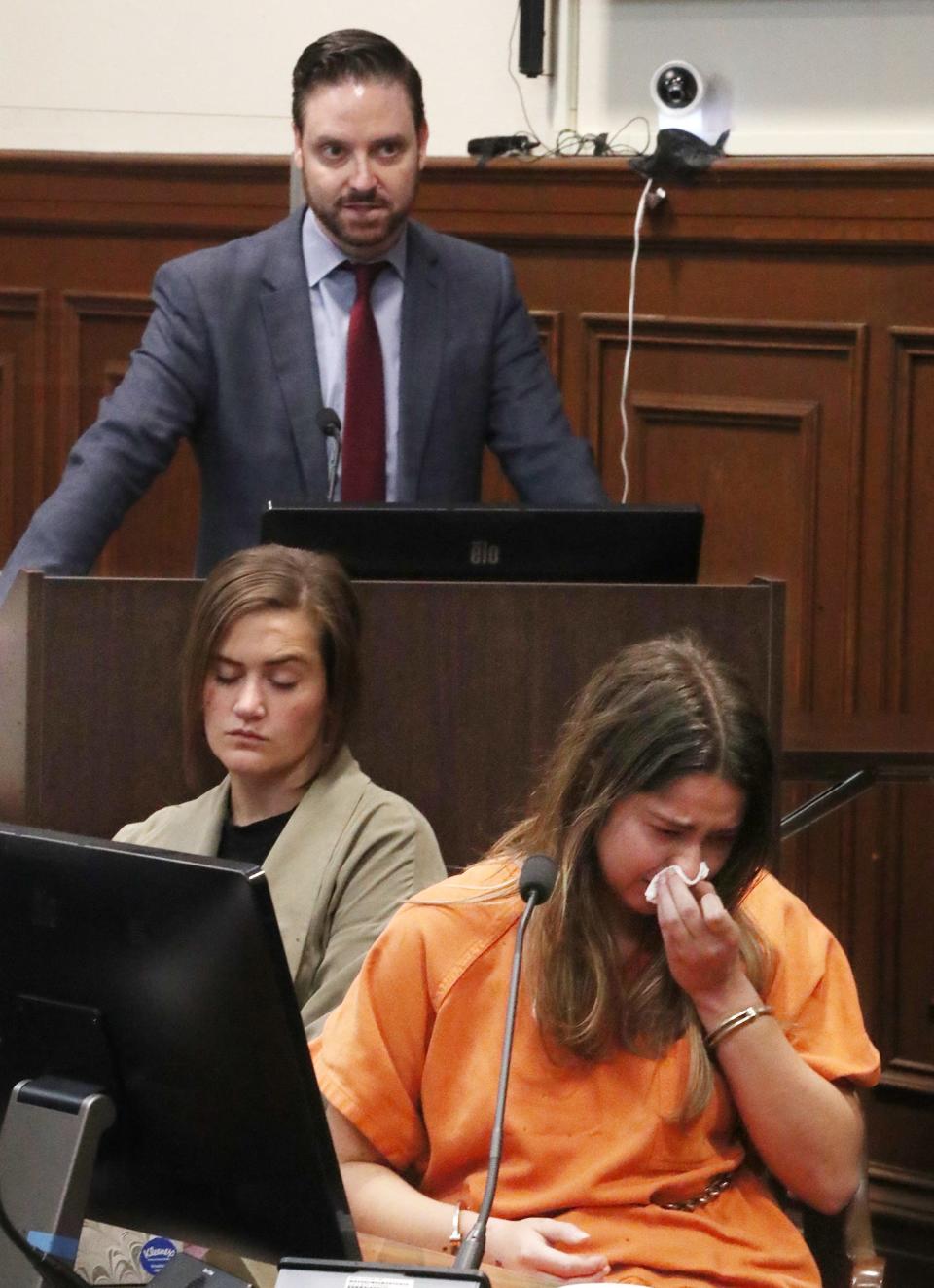 Sydney Powell listens to Jeff Laybourne, her family's attorney, during her sentencing in Summit County Common Pleas Court.  She was sentenced to 15 to life for the slaying of her mother.