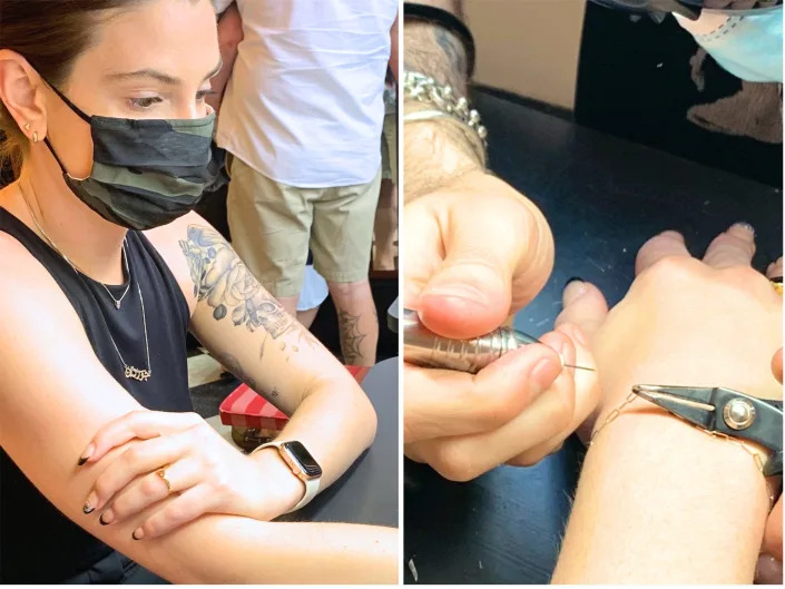 The author watches closely as a forever bracelet is permanently welded onto her at Catbird in New York.