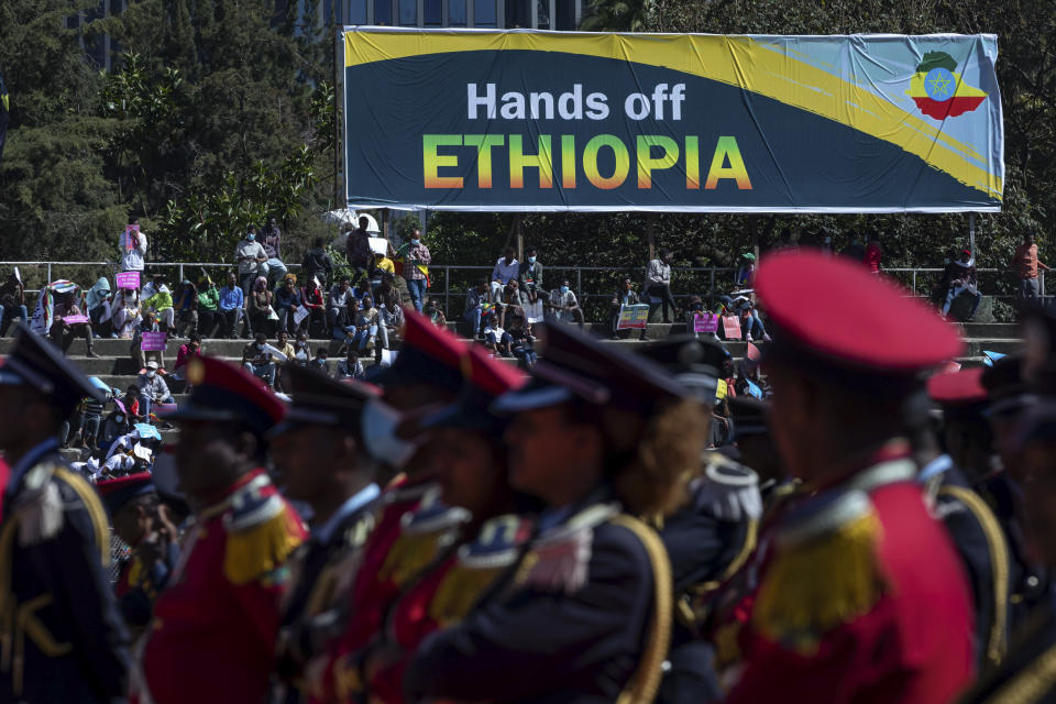 Ethiopians protest against international pressure on the government over the conflict in Tigray, at a demonstration organised by the city mayor's office held at a stadium in the capital Addis Ababa, Ethiopia Sunday, May 30, 2021. Thousands of Ethiopians gathered Sunday to protest outside pressure on the government over its brutal war in Tigray, after the U.S. said last week it has started restricting visas for government and military officials of Ethiopia and Eritrea who are seen as undermining efforts to resolve the fighting. (AP Photo/Mulugeta Ayene)