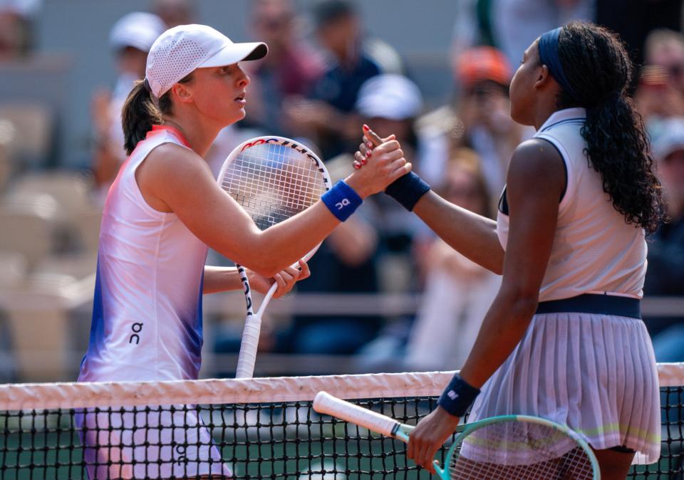 Jun 6, 2024; Paris, France; Iga Swiatek of Poland shakes hands with Coco Gauff of the United States after their match on day 12 of Roland Garros at Stade Roland Garros.