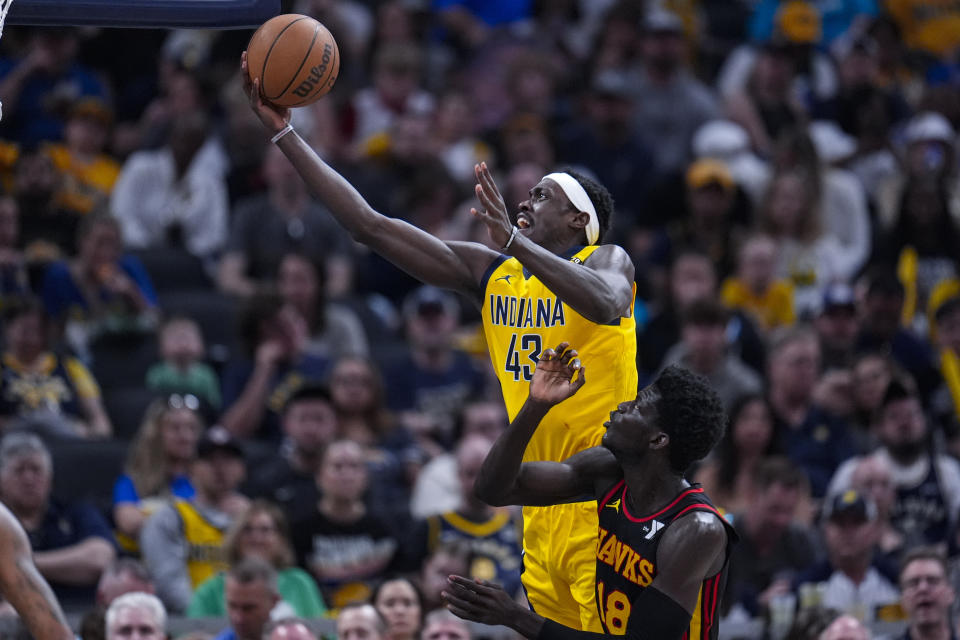 Indiana Pacers forward Pascal Siakam (43) shoots over Atlanta Hawks forward Mouhamed Gueye (18) during the first half of an NBA basketball game in Indianapolis, Sunday, April 14, 2024. (AP Photo/Michael Conroy)