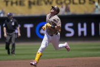 San Diego Padres' Jake Cronenworth rounds the bases after hitting a home run during the first inning of a baseball game against the Los Angeles Dodgers, Sunday, May 12, 2024, in San Diego. (AP Photo/Gregory Bull)