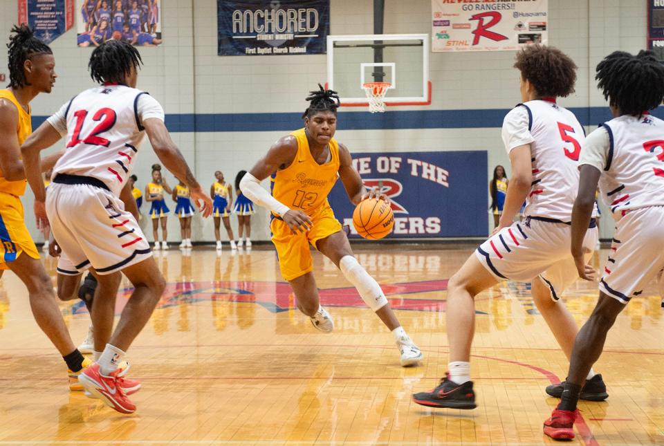 Raymond's Eric Paymon (12) drives down the court during play against Richland in Richland, Miss., Friday, Jan. 5, 2023.
