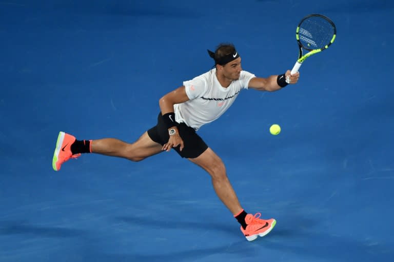 Spain's Rafael Nadal hits a return against France's Gael Monfils during their Australian Open fourth round match, in Melbourne, on January 23, 2017