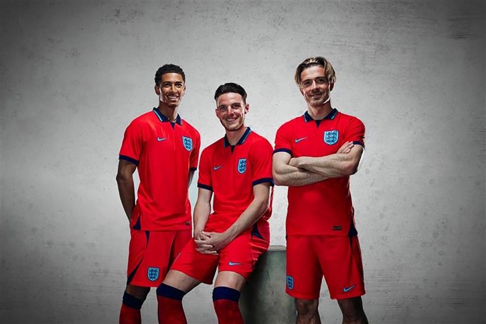 Bellingham (left) and Rice (centre) have been modelling England’s new away shirt (The FA) (PA Media)