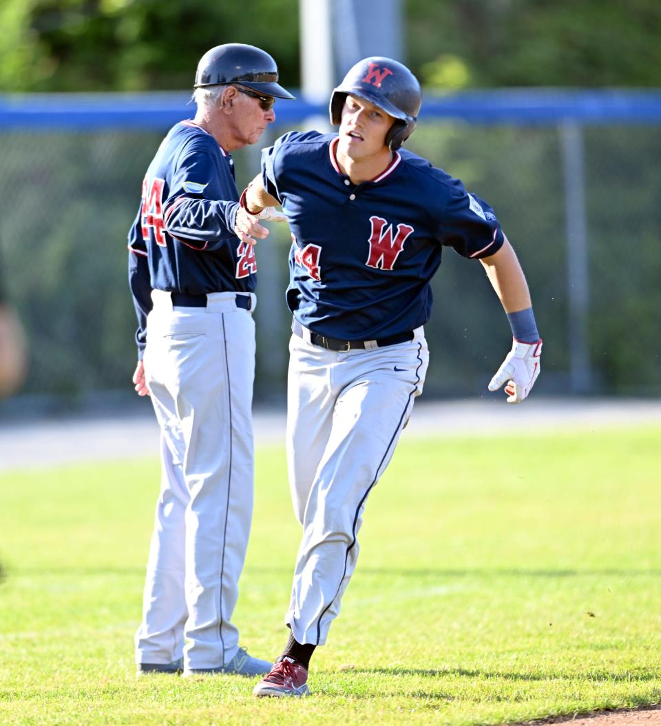 Owen Diodati rounds third congratulated by Wareham manager Harvey Shapiro after hitting a home run against Hyannis.