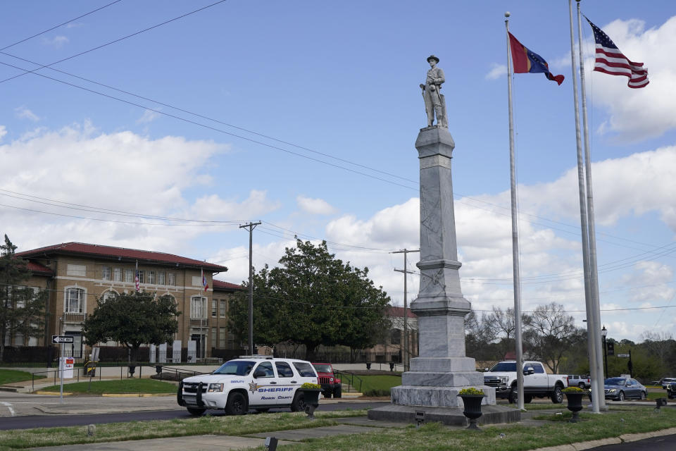 A Rankin County Sheriff's Deputy SUV drives past the Rankin County Confederate Monument in Brandon, Miss., Friday, March 3, 2023. Several members of a special unit of the Rankin County sheriff’s department that’s being investigated by the U.S. Justice Department for possible civil rights violations have been involved in at least four violent encounters with Black men since 2019 that left two dead and another with lasting injuries. (AP Photo/Rogelio V. Solis)