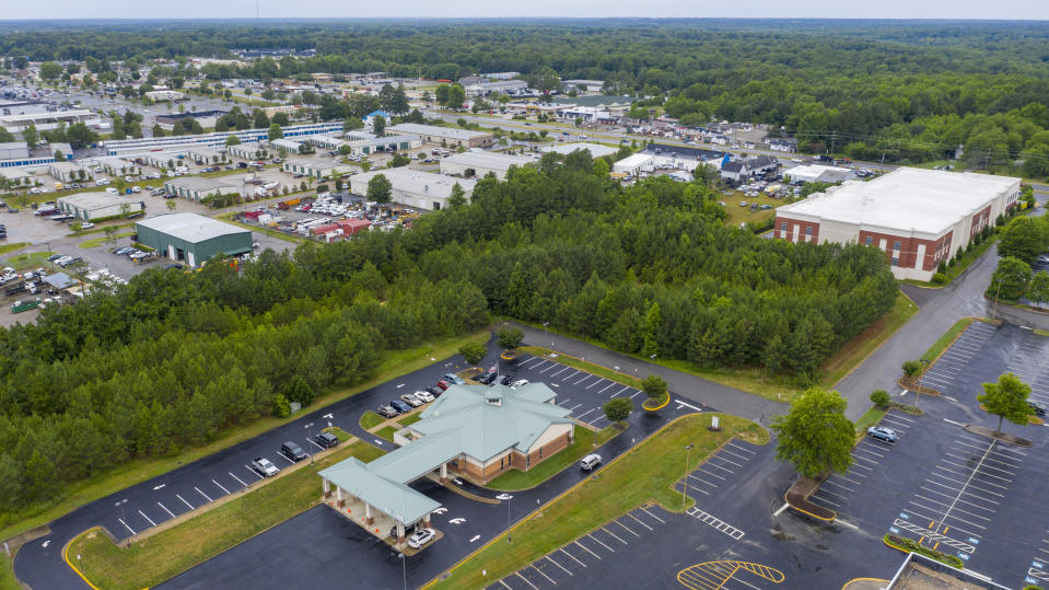 This aerial drone photo shows the Call Federal Credit Union building, front, Tuesday June 16, 2020, in Midlothian, Va. Police were able to obtain geofence search warrants, a tool being increasingly used by law enforcement. The warrant sought location histories kept by Google of cellphones and other devices used within 150 meters (500 feet) of the bank. (AP Photo/Steve Helber)