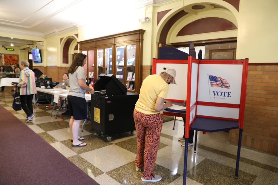 Voters cast their ballots for the school district budget vote and board election at Rochambeau Alternative High School in White Plains May 21, 2024.