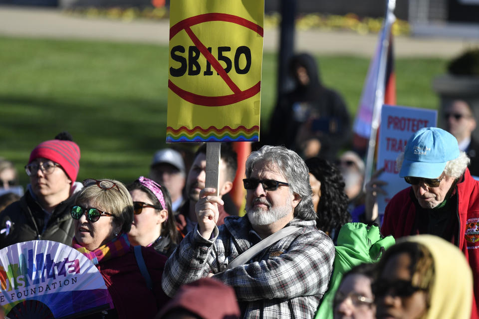 A protester shows his disapproval of Kentucky Senate bill SB150, also known as the Transgender Health Bill during a rally on the lawn of the Kentucky State Capitol in Frankfort, Ky., Wednesday, March 29, 2023. (AP Photo/Timothy D. Easley)