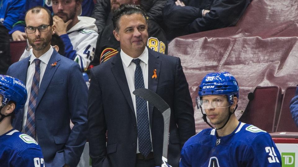 Vancouver Canucks assistant coach Jason King and head coach Travis Green on the bench against the Winnipeg Jets in the third period at Rogers Arena. Canucks won 3-2