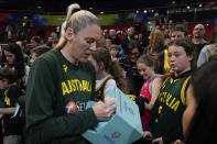 Australia's Lauren Jackson signs autographs following their win over Japan at the women's Basketball World Cup in Sydney, Australia, Tuesday, Sept. 27, 2022. (AP Photo/Mark Baker)