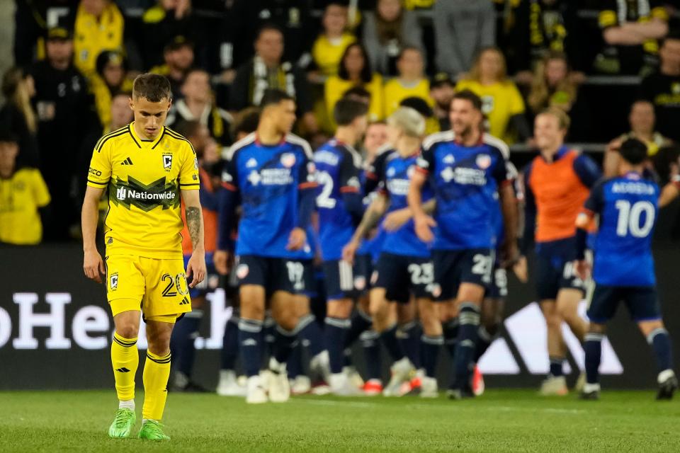 May 11, 2024; Columbus, OH, USA; Columbus Crew midfielder Alexandru Matan (20) walks to midfield after a goal by FC Cincinnati midfielder Luciano Acosta (10) during the second half of the MLS soccer game at Lower.com Field. The Crew lost 2-1.
