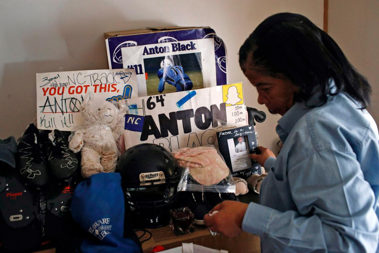 In this Jan. 28, 2019, file photo, Jennell Black, mother of Anton Black, looks at a collection of her son's belongings at her home in Greensboro, Md. 