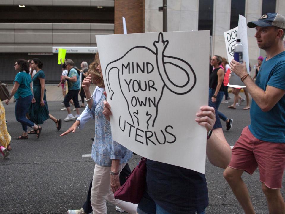 A federal trial opened on Monday with activists challenging four state laws that restrict abortion, including requirements that clinics meet stringent licensing standards, that patients get an ultrasound at least 24 hours before an abortion and that only doctors perform the procedure in the first trimester.Abortion is a relatively safe procedure for the woman, carrying less risk than a colonoscopy, plastic surgery or tonsillectomy, an expert witness testified for activists bringing the suit. Even some dental procedures pose greater danger.“It is one of the safest medical procedures that exists,” Mark David Nichols, who performs abortions in Oregon, testified in a bench trial before US District Judge Henry Hudson.But under cross-examination, Dr Nichols acknowledged that there is no formal program to train midwives, nurse practitioners or physician assistants to perform abortions.In other states, they get what the state’s lawyer called “on-the-job” training, learning informally from a doctor but then going off to work unsupervised – and perhaps train others.That seemed to catch Judge Hudson by surprise. Isn’t there a “prepared curriculum” and an established “standard of competency?” the judge asked. Dr Nichols said there was not.While a spate of states have recently made access to abortion more difficult, advocates in Virginia are trying to make it easier.The case is being heard in an election year when Republicans are trying to keep their razor-thin control of the General Assembly and when abortion politics – dormant for the past few cycles – probably will be prominent.Earlier this year, Delegate Kathy Tran caused an uproar when she filed a bill seeking to loosen restrictions on late-term abortion.During a hearing, she said the measure would allow abortion up to the moment of birth. Ms Tran later said she misspoke, but Republicans called her failed bill extreme.Governor Ralph Northam, a Democrat, added to the furore with comments on a radio show that Republicans, including President Donald Trump, said was an endorsement of infanticide.A paediatric neurologist, Governor Northam called the infanticide charge “disgusting.” He appeared to be talking about end-of-life care for a baby that is “not viable”, but he has never clarified his remarks.President Trump’s re-election campaign invoked Mr Northam’s comments as recently as last week on Twitter: “Democrat Ralph Northam on late-term abortion: ‘The infant would be delivered. The infant would be kept comfortable. The infant would be resuscitated if that’s what the mother and the family desired. And then a discussion would ensue between the physicians and the mother’.”The case in federal court in Richmond comes after Georgia, Kentucky, Mississippi and Ohio banned abortions after doctors can detect a foetal heartbeat, about six weeks – before many women realise they are pregnant.And Alabama has made performing abortions a felony unless a pregnancy seriously risks a woman’s health, with no exceptions for rape or incest.In Virginia, Delegate Bob Thomas, facing a primary challenger from the right, said last week that he would like the General Assembly to follow Alabama’s lead if Republicans can maintain control of the legislature.Mr Northam responded swiftly. “My veto pen is ready and full of ink,” he tweeted.Despite the political drama regarding the issue, the lawsuit unfolded as a staid affair, without a single protester in sight. Lawyers skipped opening statements and jumped right into questioning Dr Nichols.The doctor acknowledged under cross-examination that he typically orders an ultrasound before abortions even though the test is not mandated in Oregon.He also said some of his patients have backed out of planned abortions after seeing an ultrasound image of the foetus.Judge Hudson, appointed by President George W Bush, agreed with plaintiffs two weeks ago that first-trimester abortions are simple and safe enough to be performed without a physician. It was the first time a federal judge had come to that conclusion.But a week later, he vacated his own order to allow non-doctors to perform most abortions in Virginia, saying the issue should be decided in the trial, which is scheduled to last until 6 June.The lawsuit was brought by a coalition of abortion rights groups, including the Centre for Reproductive Rights, the Virginia League for Planned Parenthood and several clinics across the state.The state Department of Health and the office of Virginia Attorney General Mark Herring, a Democrat, are defending the rules.The case has put Justice Herring in an awkward position as both an advocate for abortion rights and the state official tasked with defending Virginia law.He did not formally recuse his office from the case but hired a private firm, Hirschler Law, saying he did not have enough staffers to handle it.Representing the plaintiffs, Sean Trainor of the Washington firm O’Melveny spent the trial’s opening hours questioning Dr Nichols about the safety of abortion.Under cross-examination by Hirschler President Courtney Paulk, Dr Nichols said 16 states allow non-doctors to dispense medications used to induce abortions in the earliest stages of pregnancy, up to 10 weeks.Five allow non-doctors to perform a procedure based on suction, which is typically used up to 16 weeks.No state allows non-doctors to perform the procedure known as dilation and extraction, which can be used up to the point of viability.The Washington Post