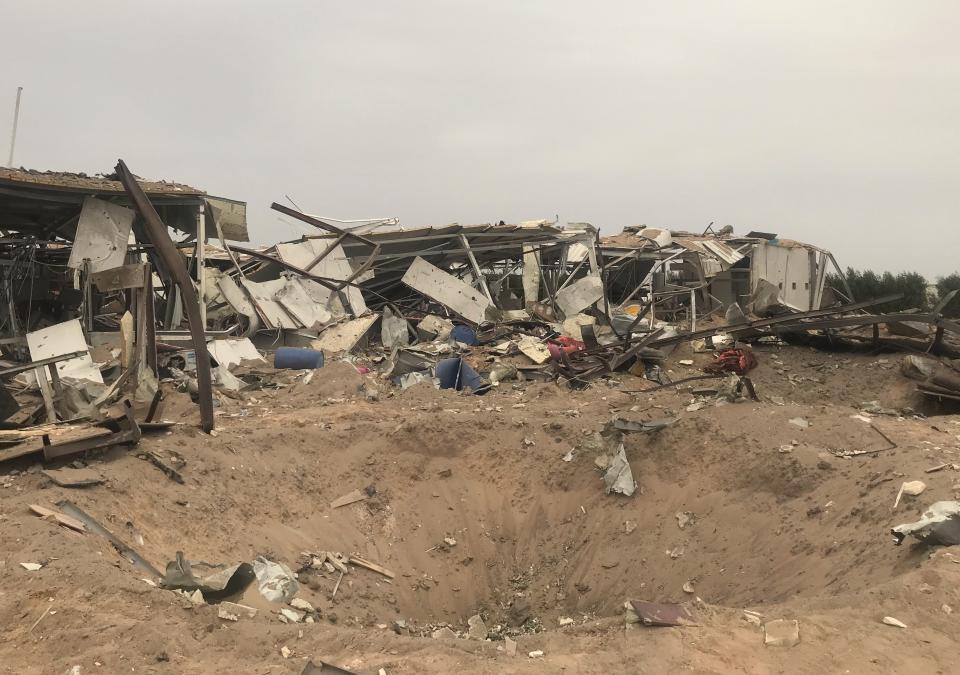 Destroyed buildings are seen at an airport complex under construction in Karbala, Iraq, Friday, March 13, 2020. Iraq's military said five security force members and a civilian were killed early Friday in a barrage of U.S. airstrikes, which were launched hours after a rocket attack killed and wounded American and British servicemen at a base north of Baghdad. (AP Photo/Anmar Khalil)