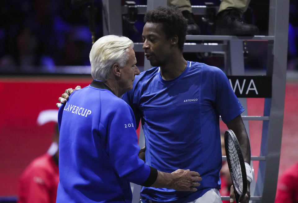 Team Europe's Gael Monfils, right, talks to captain Bjorn Borg during a Laver Cup tennis match Friday, Sept. 22, 2023, in Vancouver, British Columbia, against Team World's Felix Auger-Aliassime. (Darryl Dyck/The Canadian Press via AP)