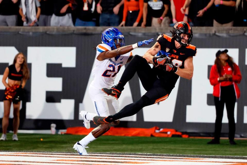 Sep 3, 2022; Corvallis, Oregon, USA; Oregon State Beavers tight end Luke Musgrave (88) makes a catch in the end zone for a touchdown while being defended by Boise State Broncos corner back Tyreque Jones (21) during the first half at Reser Stadium. Mandatory Credit: Soobum Im-USA TODAY Sports