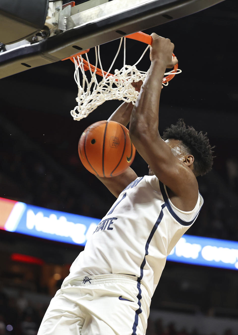 Utah State forward Great Osobor dunks against San Diego State during the first half of an NCAA college basketball game in the semifinals of the Mountain West Conference men's tournament Friday, March 15, 2024, in Las Vegas. (AP Photo/Ronda Churchill)