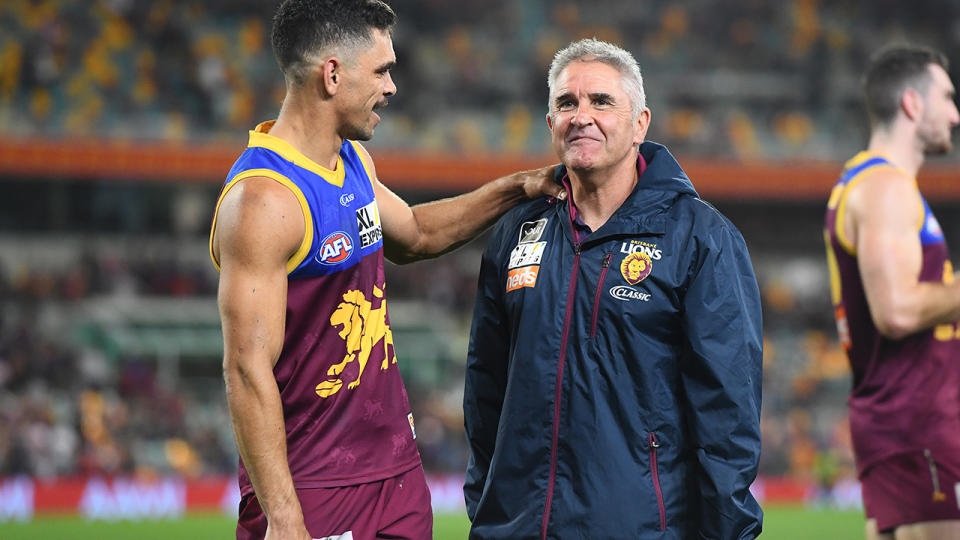 Charlie Cameron, left, and Brisbane Lions coach Chris Fagan, right, are pictured after their win over the Tigers.