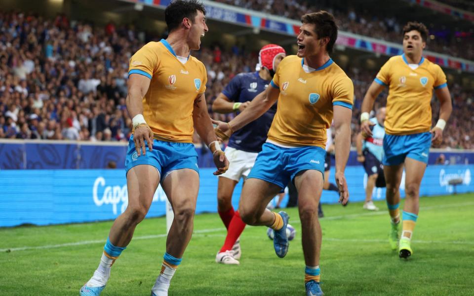 Uruguay's Baltazar Amaya celebrates scoring a try with Tomas Inciarte against France