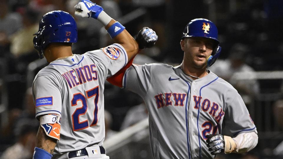 New York Mets first baseman Pete Alonso (20) is congratulated by third baseman Mark Vientos (27) after hitting a solo home run against the Washington Nationals during the fifth inning at Nationals Park