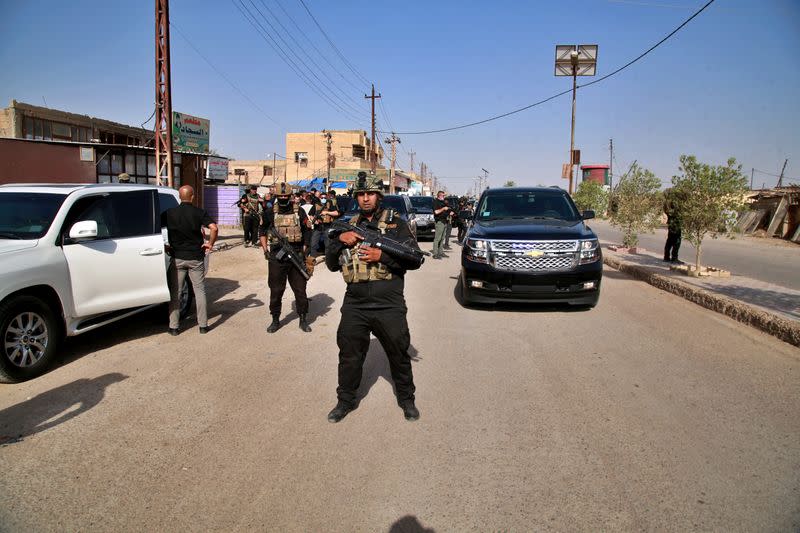 Iraqi Prime Minister Mustafa al-Kadhimi speaks to locals in Tarmiyah