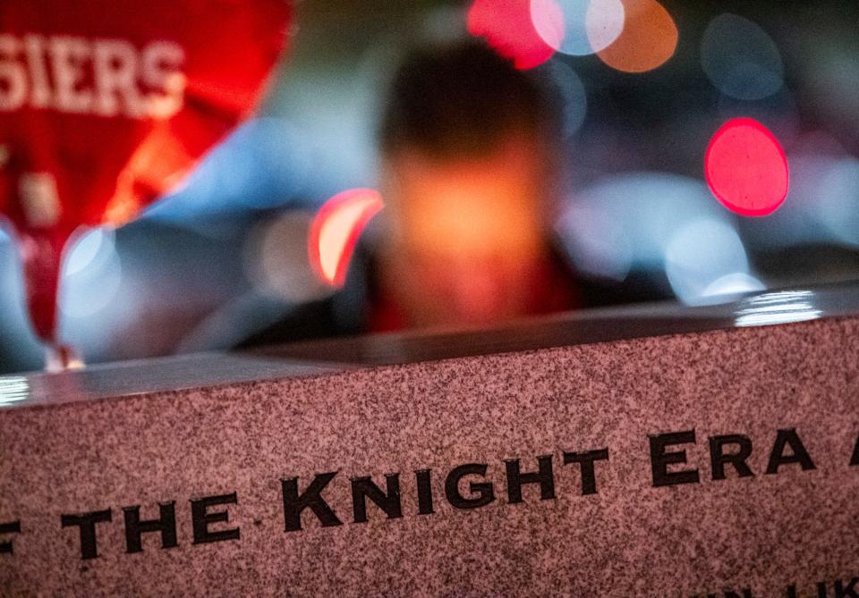 Fans take a moment after the women's basketball game to stop by the makeshift memorial for former Head Coach Bob Knight after the Indiana versus Northwood women's basketball game at Simon Skjodt Assembly Hall on Wednesday, Nov. 1, 2023. Knight passed away earlier that evening at 83.