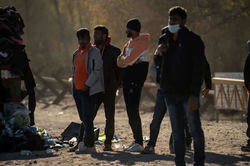 Migrants cross the border in Yuma, Arizona