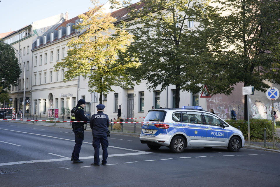 FILE - German police officers stand guard in front of the building complex of the Kahal Adass Jisroel community, which houses a synagogue, a kindergarten and a community center, in the center of Berlin, Germany, Wednesday, Oct. 18, 2023. European Union interior ministers met Thursday, Oct. 19, 2023, to discuss how to manage the impact of the war between Israel and Hamas on the bloc, after a firebomb assault on a Berlin synagogue and killings in Belgium and France by suspected Islamist extremists. (AP Photo/Markus Schreiber, File)