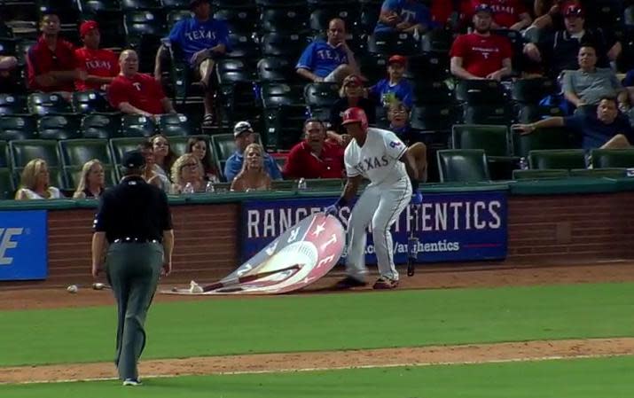 Adrian Beltre moves the on-deck circle while umpire Gerry Davis looks on. (MLB)