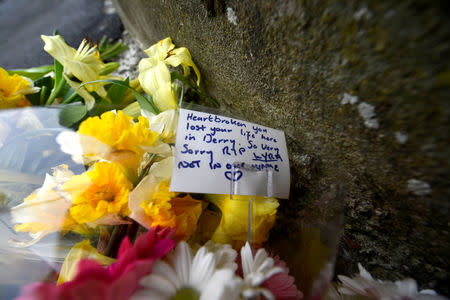 Flowers are seen at the scene where the 29-year-old journalist Lyra McKee was shot dead, in Londonderry, Northern Ireland April 19, 2019. REUTERS/Clodagh Kilcoyne