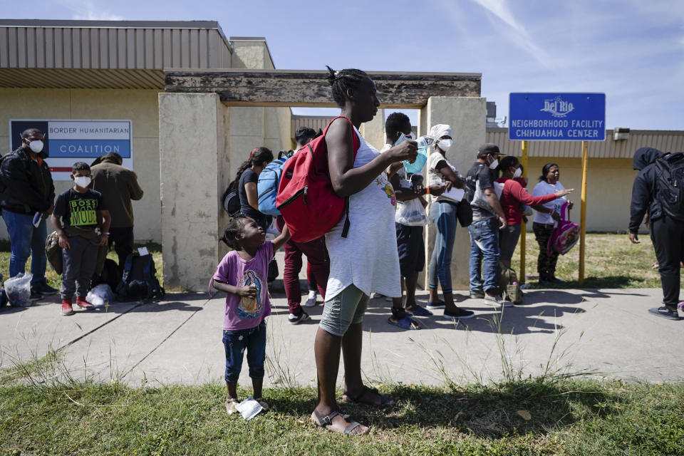 Migrants, many from Haiti, wait to board a bus to Houston at a humanitarian center after they were released from United States Border Patrol upon crossing the Rio Grande and turning themselves in seeking asylum, Wednesday, Sept. 22, 2021, in Del Rio, Texas. (AP Photo/Julio Cortez)