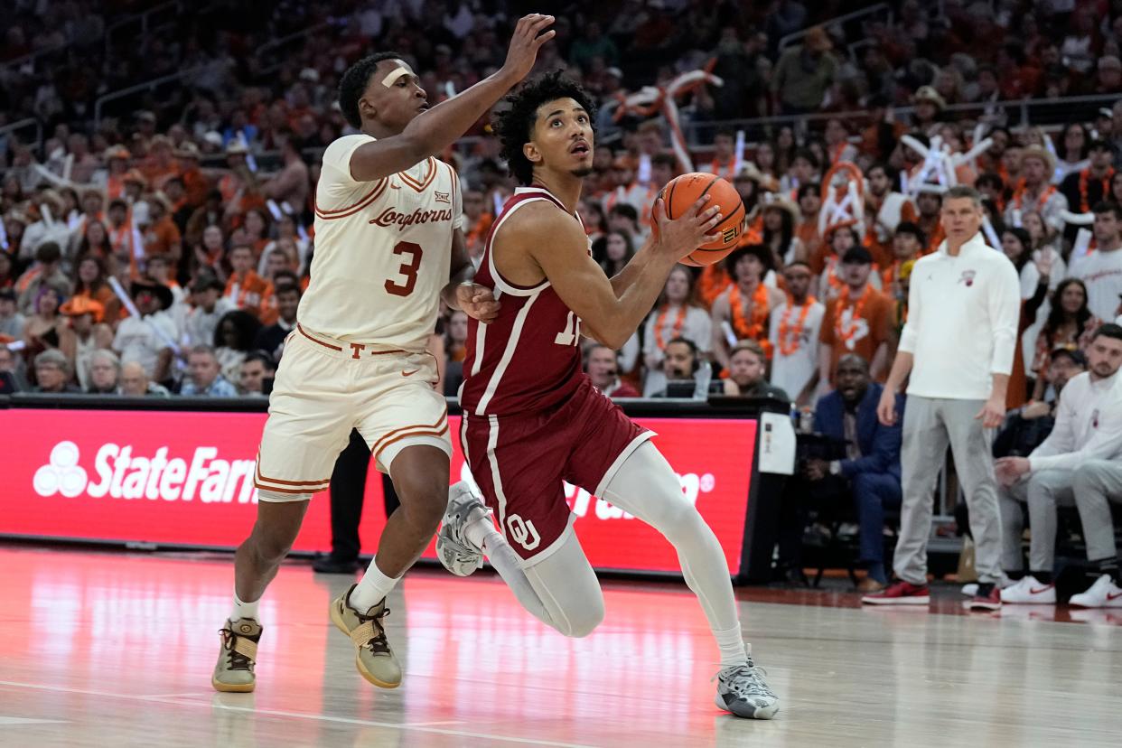 Oklahoma guard Milos Uzan (12) drives to the basket while defended by Texas guard Max Abmas (3) during the second half at Moody Center.