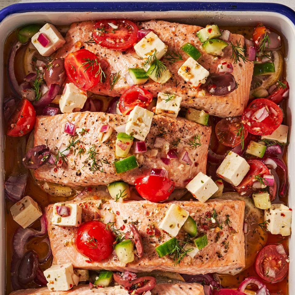 greek salmon with feta, tomatoes, lives, red onion, and cucumber