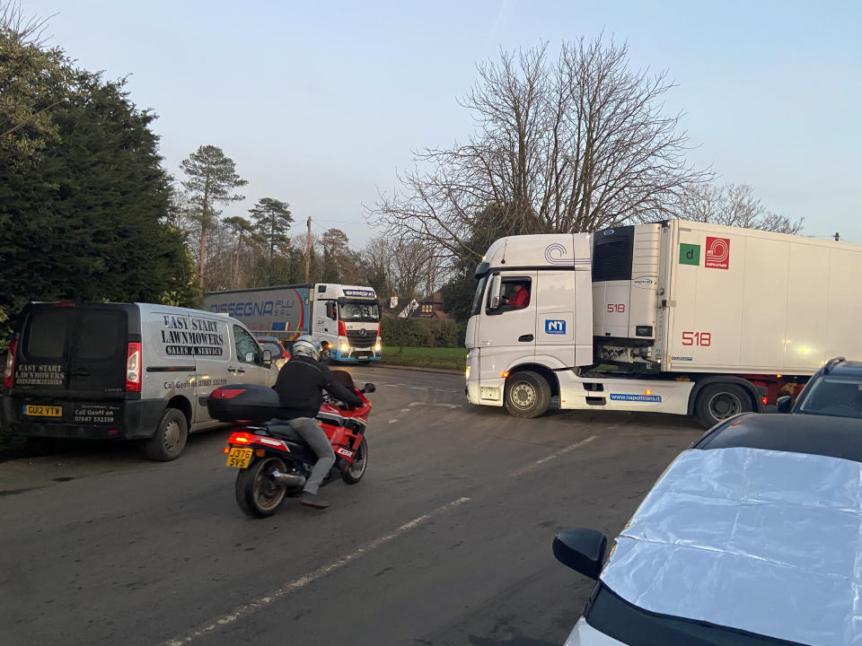 Lorries in the small village of Mersham near Ashford, Kent. See SWNS copy NNvillage: Lost truckers are clogging up a small village because the government is giving them the wrong postcode for their new Brexit lorry park. Frustrated residents living in Mersham near Ashford, Kent, have seen their narrow country lanes blocked by HGVs that have been given incorrect directions. Around 30 lorries arrived in the village since the 66-acre lorry park opened for coronavirus testing on Monday.