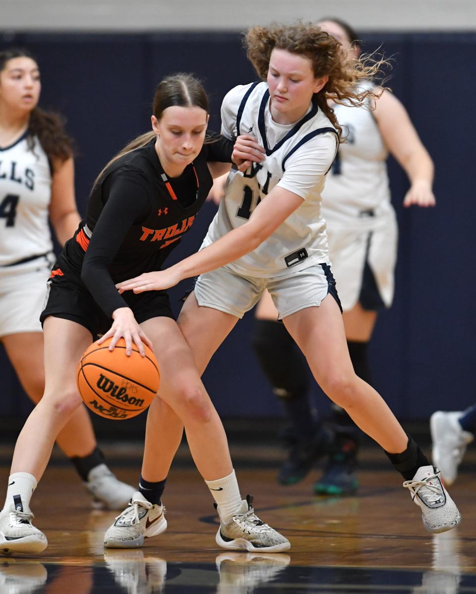 Lely's Oleksandra Rubanova (#5) tries to keep Parrish's Mary Portwood (#10) from stealing the ball. Parrish Community High School hosted Lely High School in the Class 5A Region 3 girls basketball playoff Monday night, Feb. 19, 2024